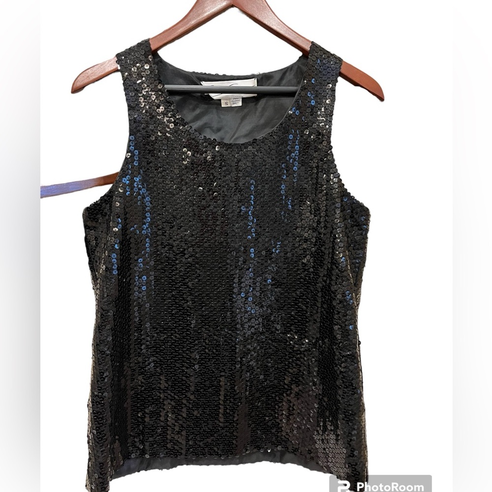 Black sequins top. Statement piece with a festive twist. Size S